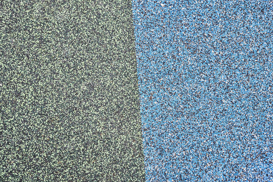 Texture. Childrens playground floor.Rubber and stones.