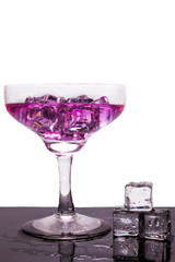 Cocktail of bright colors on a black background.