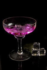 Cocktail of bright colors on a black background.