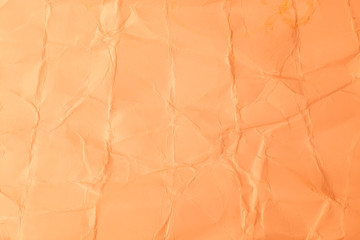 Texture creased orange paper background.