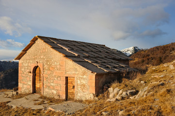 alpine summer house at sunset