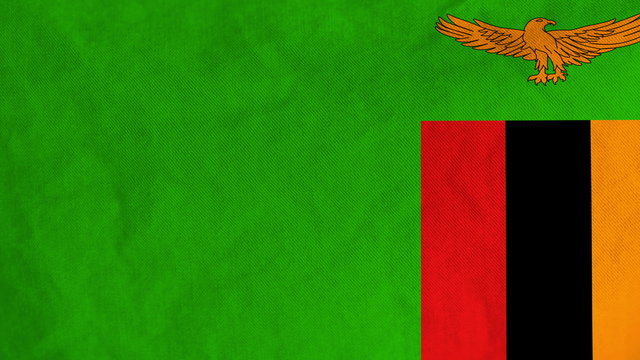 Zambian flag waving in the wind (full frame footage in 4K UHD resolution).