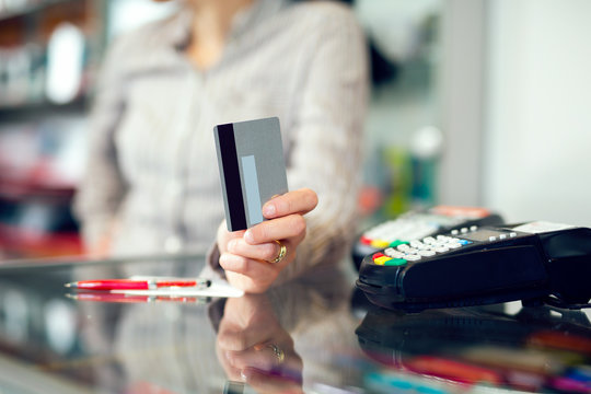 Woman holding credit card in hand