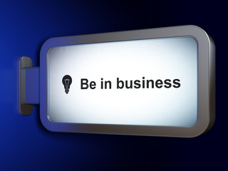Business concept: Be in business and Light Bulb on billboard background