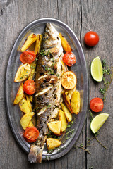 Grilled fish with baked potato wedges