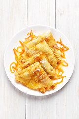 Crepes with orange sauce
