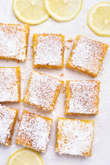 Lemon bars over baking paper, top view