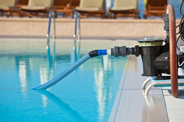Obraz na płótnie Canvas Cleaning pump working with a swimming pool