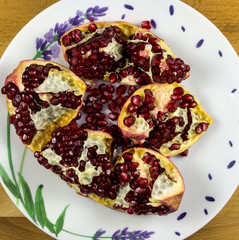 Ripe pomegranate fruit on a plate