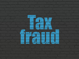 Law concept: Tax Fraud on wall background