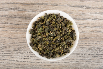 Grean tea leaves on table