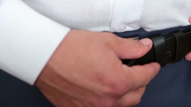 Men clasps fly on trousers on white background