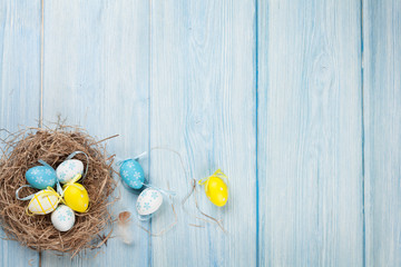 Easter background with eggs in nest