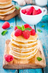 Homemade pancakes with honey and raspberry