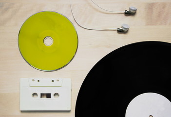 music in green cd cassette tape vinyl disk and earphone