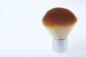 A set of bamboo brushes for applying makeup. Brushes for makeup: blush. Yellow and silver color on a white background.