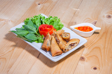 Fried Chinese Traditional Spring rolls food isolated on wood bac