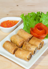 Fried Chinese Traditional Spring rolls food isolated on wood bac