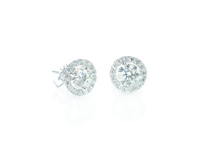 Beautiful Halo Diamond Stud earrings with reflection isolated on white