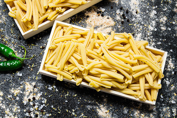 uncooked pasta with spices
