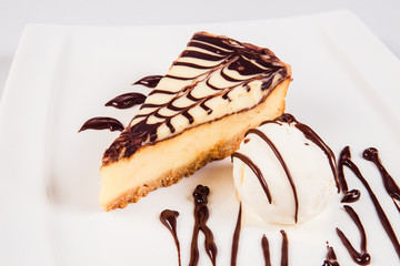 Dessert ice cream chocolate cake on white plate on a light background