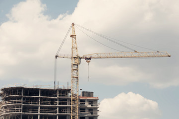 Urban development and construction. Photo toned in vintage style