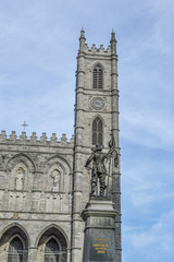 Fototapeta na wymiar Maisonneuve statue facing Basilica Notre Dame, Montreal's Old Port district