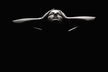 Foto op Plexiglas girl holding the face like a mask.woman body dark female silhouette © eugenepartyzan