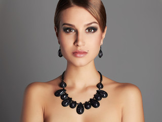 girl in jewelry. beautiful sexy woman with short hair and make-up