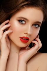Woman face with red lips close-up. Beauty and Fashion. Portrait of a beautiful young girl