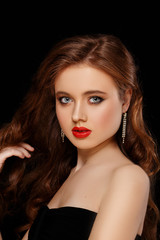 Fototapeta premium Woman face with red lips. Beauty and Fashion. Portrait of a beautiful young girl