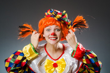 Clown in funny concept on dark background