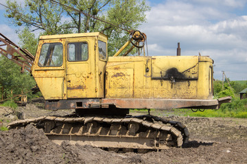 Fototapeta premium Old yellow excavator