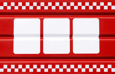  red metal plate with three white rectangles for symbols