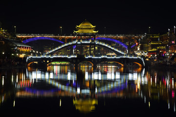 Fototapeta na wymiar View of illuminated stone bridge in Fenghuang