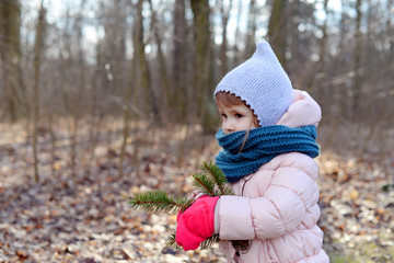 Little girl on a nature scavenger hunt