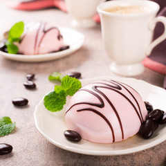 Mousse cakes covered with pink glaze 