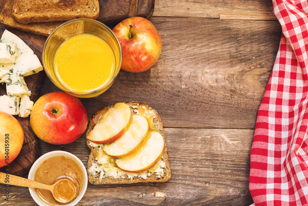 Wall mural breakfast toast with apple, honey and gorgonzola cheese