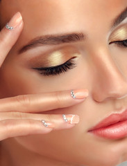 Luxury fashion style, manicure nail , cosmetics and makeup . beige nails with rhinestones  . Golden make up and eyelashes - 104017149