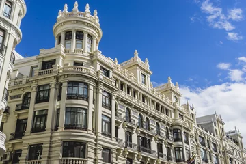 Fototapeten characteristic buildings on the street Gran Via in Madrid, capit © Fernando Cortés