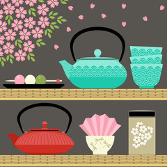 Oriental tea time with teapots, cups, flowers and sweets