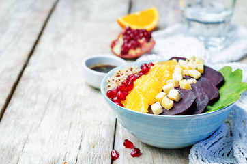 Quinoa spinach beet orange pomegranate blue cheese salad