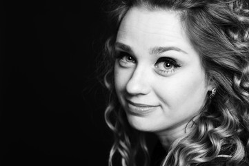 Fototapeta premium Black and white portrait of beautiful woman 20-25 year old. Smiling girl closeup. Young adults. 