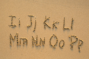 Alphabet written in light beach sand, part 2 of 4 (I-P)