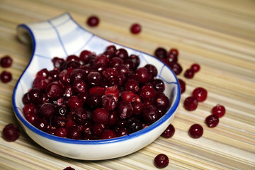 Frozen cranberries in a large spoon 