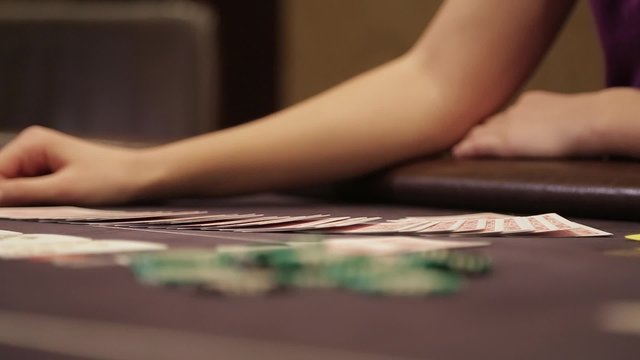 The dealer lays out the cards.
