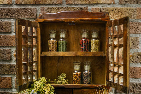 Vintage Wooden Spice Rack or Storage Cabinet and six glass bottl