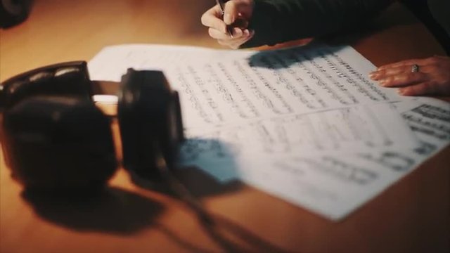 Female hand holding a paper - lyrics