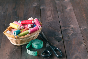 Wooden table with sewing utensils