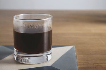 Transparent glass with aero press coffee isolated